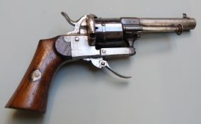 Belgian 7mm pinfire six-shot double action revolver with shaped wooden grips, folding trigger and
