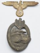 Two German WW2 Third Reich Nazi badges, Tank Assault badge stamped AS to back, together with a Eagle