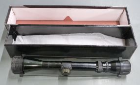 AGS Sapphire Duplex 3-9x40 air rifle scope with lens covers, in original box.