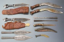 Two kukri knives, blade length 30cm, two tribal knives in sheaths, spear heads etc. PLEASE NOTE