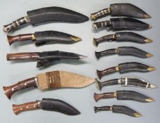 Thirteen kukris some G K & Co Nepal, all with sheaths, largest blade 20cm. PLEASE NOTE ALL BLADED