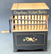 Orgelbau Stuber Berlin paper roll organ, with eight music rolls, two test rolls and two monkeys,