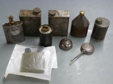 Nine vintage oil bottles including some with military marks.