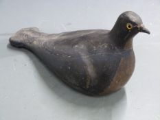 A 19thC painted plaster pigeon decoy with inset glass eyes, 33cm long.