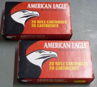 Ten American Eagle .308 Win rifle cartridges together with 15 empty cases, in two original boxes.