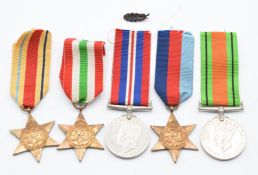 British Army WW2 medals comprising 1939-1945 Star, Africa Star, Italy Star, Defence and War