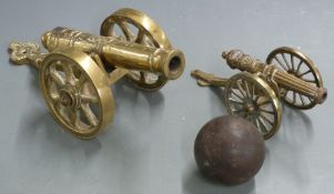 Two brass desk or signalling cannon one stamped 1812, largest 28.5cm long together with a bronze