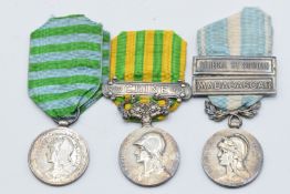Three French medals including Madagascar Campaign 1883-1886, Colonial Medal with clasps for