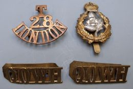 British Army Queen's Own Worcestershire Hussars cap badges and a pair of shoulder titles, together