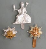 Three British Army Royal Anglian Regiment metal cap badges including officer's small gilt example