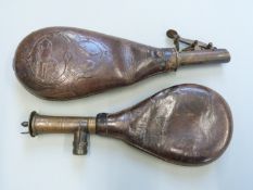 Two leather shot flasks, both with brass fittings and one with embossed decoration of dogs and