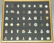 Forty-eight British Army cap badges including Blues and Royals, Royal Scots Greys, Royal Hussars,