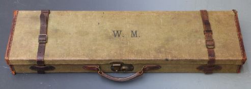 Vintage canvas and leather bound shotgun case with fitted interior and original label 'T.