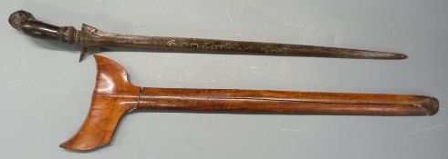 Kris dagger with carved pommel, engraved grip and wooden sheath, 43cm decorated blade. PLEASE NOTE