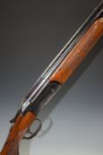 Valmet 12 bore over and under shotgun with pattern engraved locks, single trigger, chequered and
