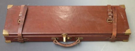 Leather or similar bound gun case with fitted interior, brass lock and corners and 'William Powell &