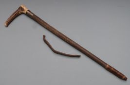 A hallmarked silver mounted riding crop
