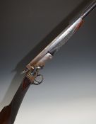 Unnamed 32 bore single barreled hammer action shotgun with engraved lock, chequered grip and forend,