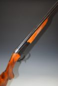 Baikal12 bore single barrelled shotgun with engraved animal scenes to the lock, chequered semi-