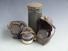 British WW2 gas mask by S.G & Co Ltd dated August 1940, together with an earlier example by L & B.