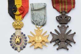 Two Belgium medals comprising Industrial Labour Medal and Croix de Guerre, together with a Serbian