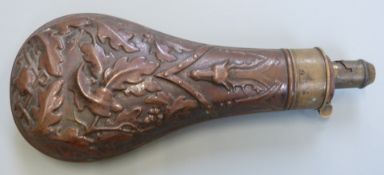 G & JW Hawksley copper and brass powder flask with embossed stags head and oak leaf decoration, 21cm
