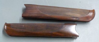 Two Beretta DT10 chequered shotgun forends, each 26cm long.