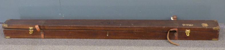 A leather and brass bound wooden fishing rod box with leather straps and key, L196cm