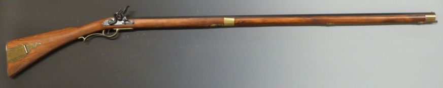 Replica flintlock Kentucky style rifle with working action, gilt mounts and 43 inch octagonal
