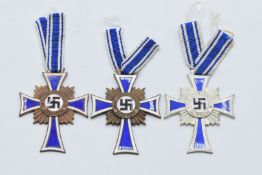 Three German WW2 Third Reich Nazi Mother's Cross Medals comprising gold, silver and bronze award