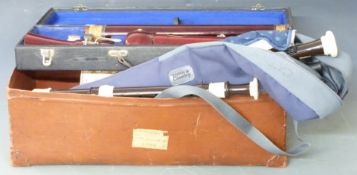 A large collection of whistles and recorders including a cased bass fruitwood soprano, Yamaha