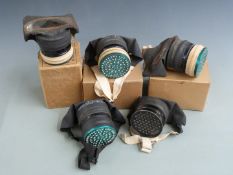 Five cased civilian gas masks