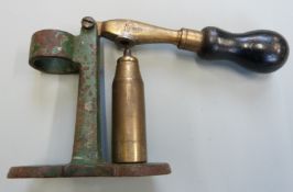 12 bore brass and metal shotgun cartridge capper and decapper with turned wooden handle.