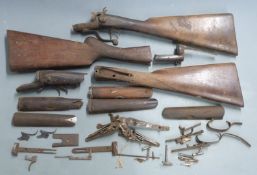 A collection of shotgun parts including centrefire actions, W Singer of Cardiff pinfire action,