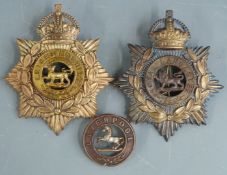 Two British Army other ranks blue cloth helmet plates for the Royal Lancaster Regiment and