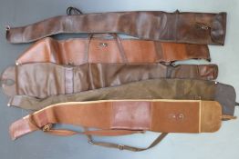 Five leather and similar gun slips.