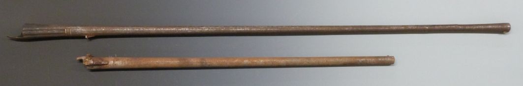 Two muzzle loading gun barrels the larger from an Eastern matchlock or similar gun with fluted