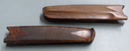 Two Beretta or Miroku 20 or 28 bore chequered shotgun forends, 23 and 22.5cm long.