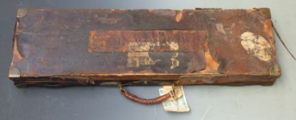 C B Vaughan leather bound gun case with brass lock and corners, fitted interior and original 'C B