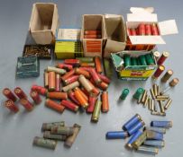 A collection of various collectable shotgun cartridges including paper cased examples, flare gun