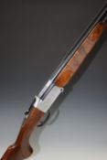 Italian 20 bore over and under shotgun with engraved lock, underside and top plate, chequered semi-