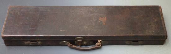 Leather bound gun case with fitted interior and brass lock, 82x23x8cm.