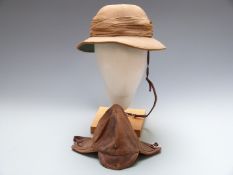 Hawkes & Co Ltd, Cork patent tropical hat, label size 6 3/4, together with a leather flying /