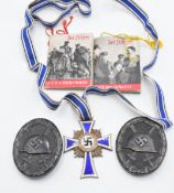 Two German WW2 Third Reich Nazi Wound badges, together with Mothers Cross and two 'Der Fuhrer'