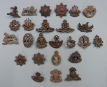 Approximately twenty five British Army Officer's Service Dress, cap and collar badges including