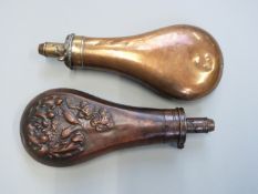 Two copper and brass powder flasks, one G & J W Hawksley the other with embossed decoration of birds