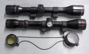 Two rifle scopes Simmons 21029 3-9x40 with scope mounts and lens covers and one other with scope
