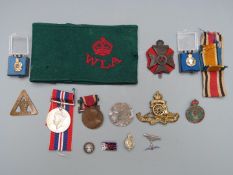 Small collection of badges including Royal Artillery, King's Royal Rifle Corps, On War Service 1916,