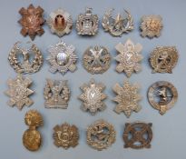 Nineteen British Army and Scottish Regiments badges including Royal Scots, Highland Light