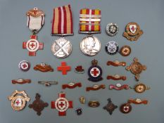 Red Cross and St John Ambulance Brigade medals and badges including a Voluntary Medical Service